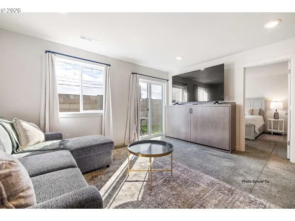 a living room with furniture and a window