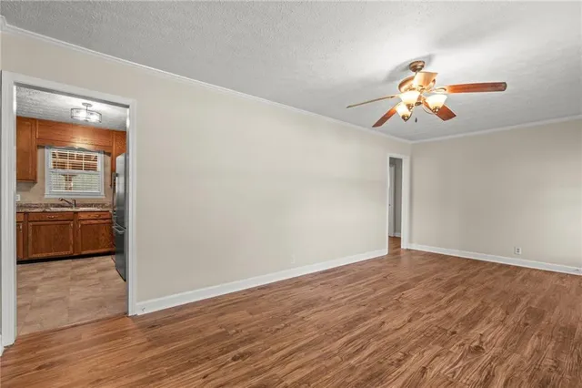 a kitchen with granite countertop stainless steel appliances and wooden cabinets