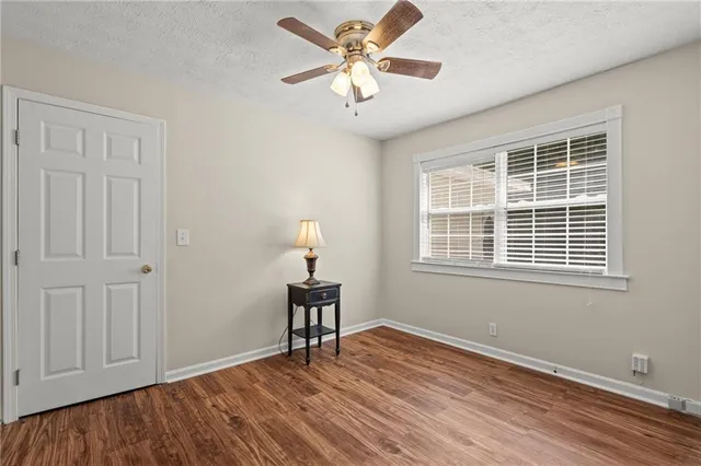 a bathroom with a bathtub and a toilet