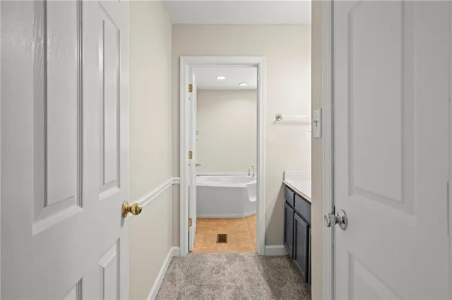 a bathroom with a bathtub and shower
