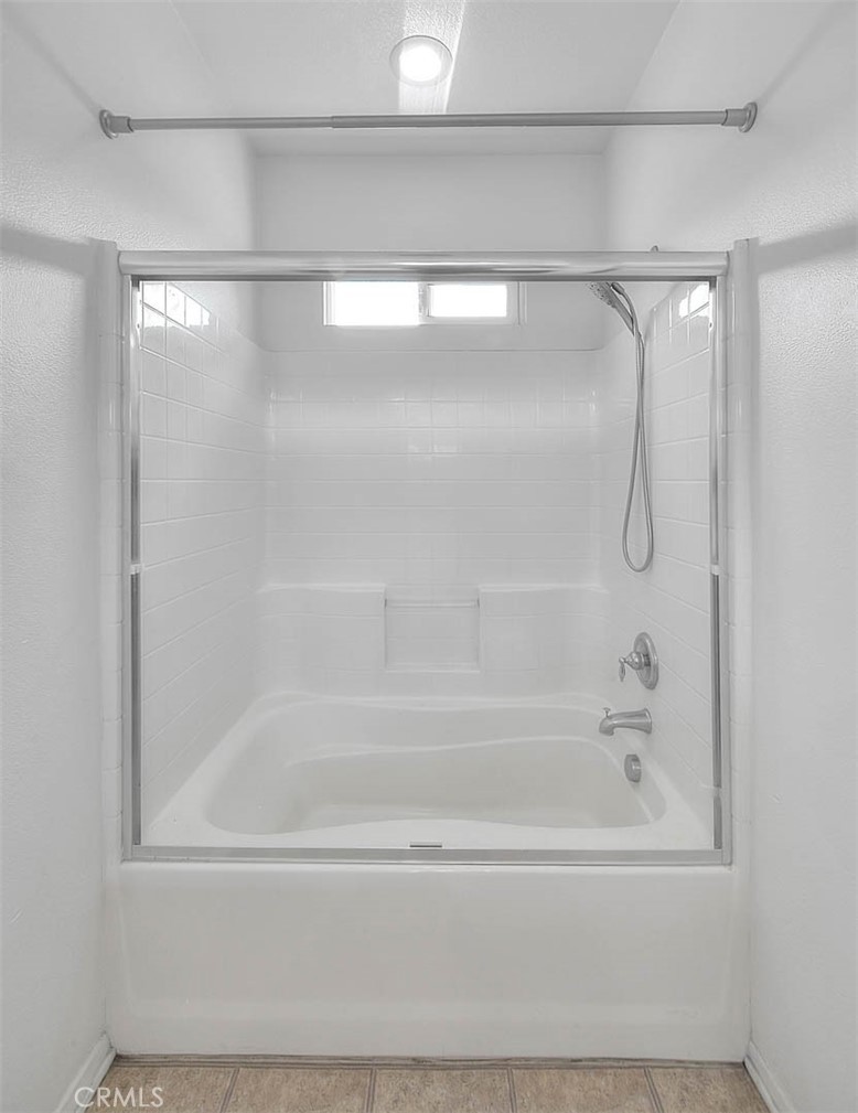 8150 West Preserve Loop Chino, CA 91708 - Photo 31 of 51 a bathroom with a shower and a bath tub