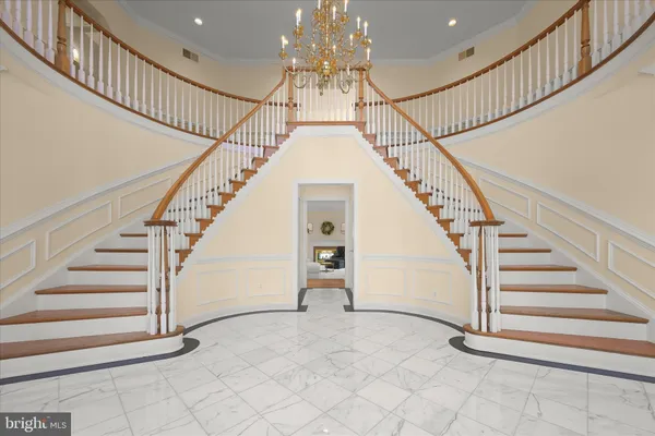 a living room with furniture a lamp and a table