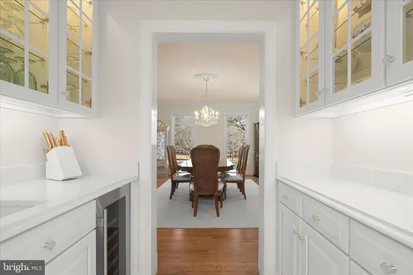 a view of a balcony with furniture and wooden floor