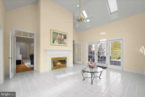 a living room with furniture a window and a dining table