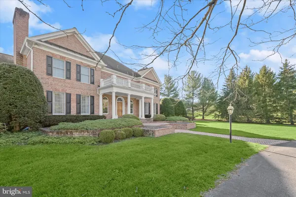 a dining room with furniture a fireplace and large windows