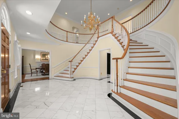 a living room with furniture and large windows