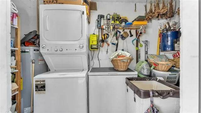 a view of a chair and table in backyard of the house