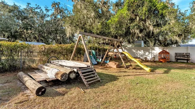a view of a house with wooden floor roof and furniture