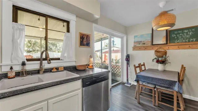 a very nice looking kitchen with a large window