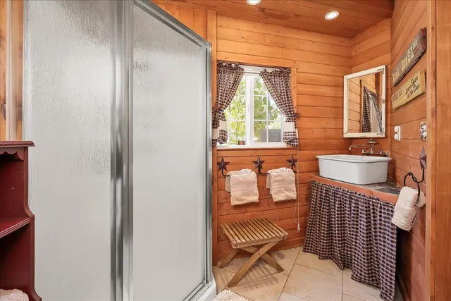 a view of a bedroom with a bed and a dresser