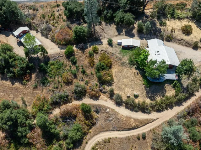an aerial view of residential house with outdoor space