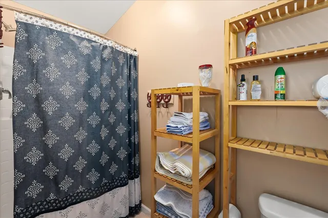 a bedroom with a bed and dresser