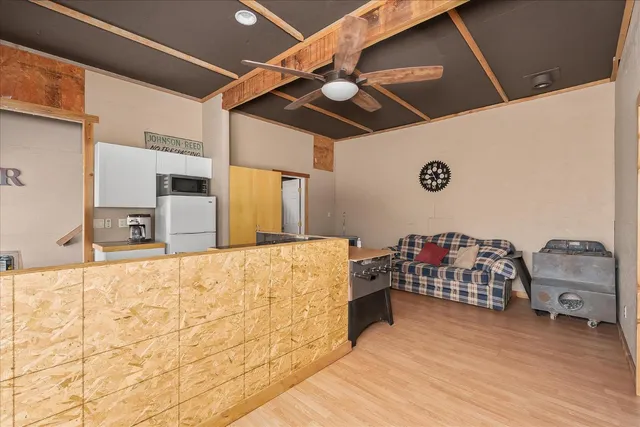 a view of small space with wooden floor and windows