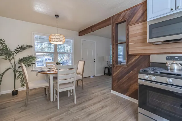 a view of a dining room with furniture window and wooden floor