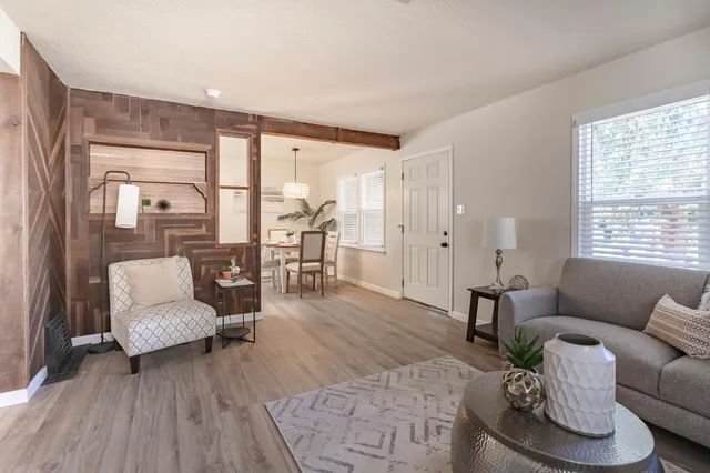 a living room with furniture and a large window