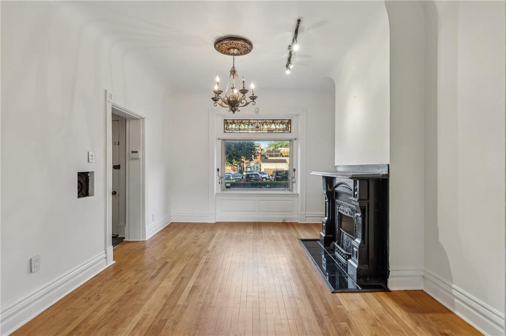 1218 Sherman Avenue Pittsburgh, PA 15212 - Photo 11 of 48 wooden floor in an empty room with a window