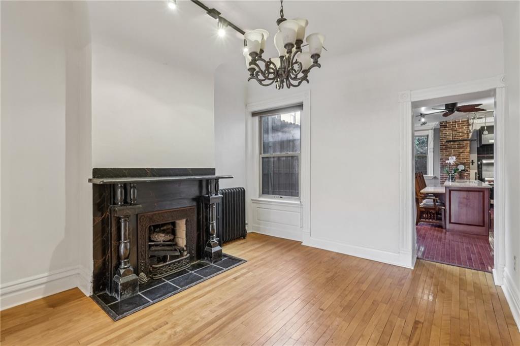 1218 Sherman Avenue Pittsburgh, PA 15212 - Photo 16 of 48 a view of a livingroom with wooden floor and a fireplace