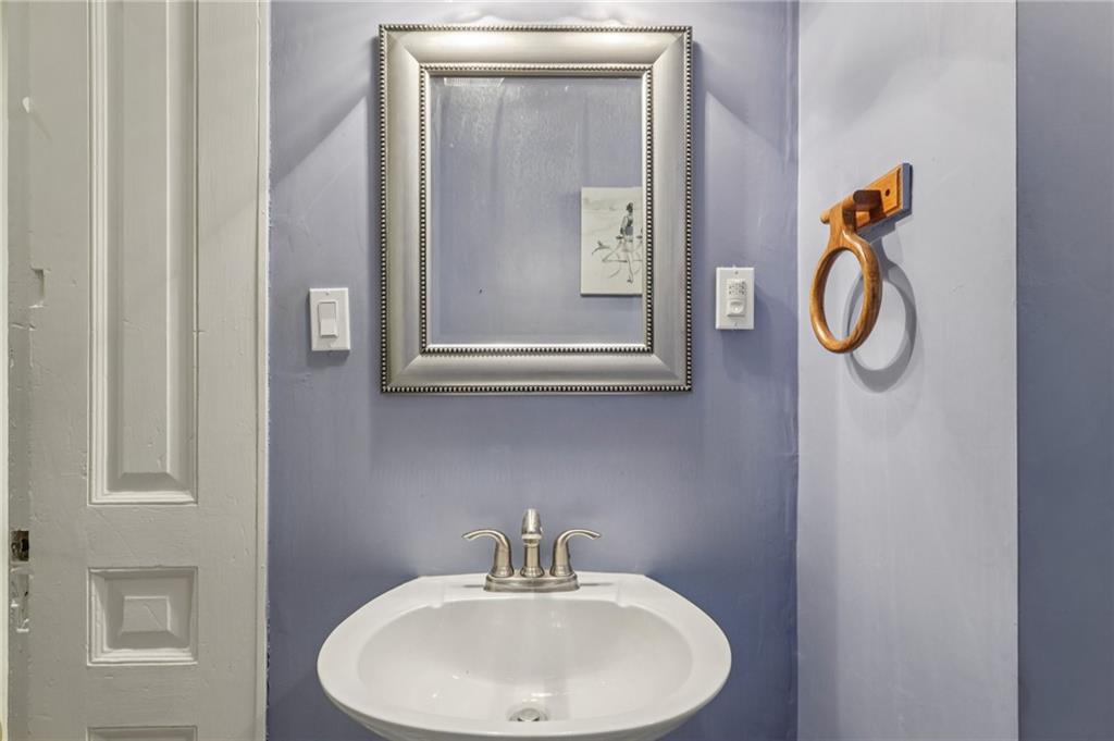1218 Sherman Avenue Pittsburgh, PA 15212 - Photo 23 of 48 a bathroom with a sink and a mirror