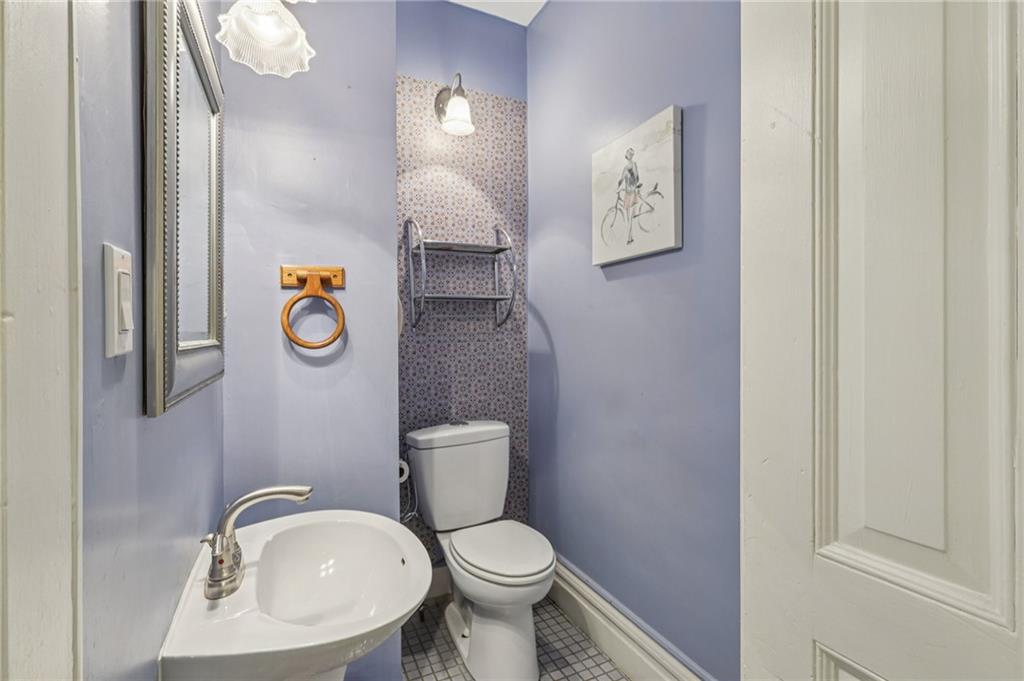 1218 Sherman Avenue Pittsburgh, PA 15212 - Photo 24 of 48 a white toilet sitting next to a bathroom sink