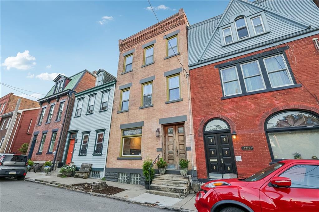 1218 Sherman Avenue Pittsburgh, PA 15212 - Photo 3 of 48 a front view of a building with street view