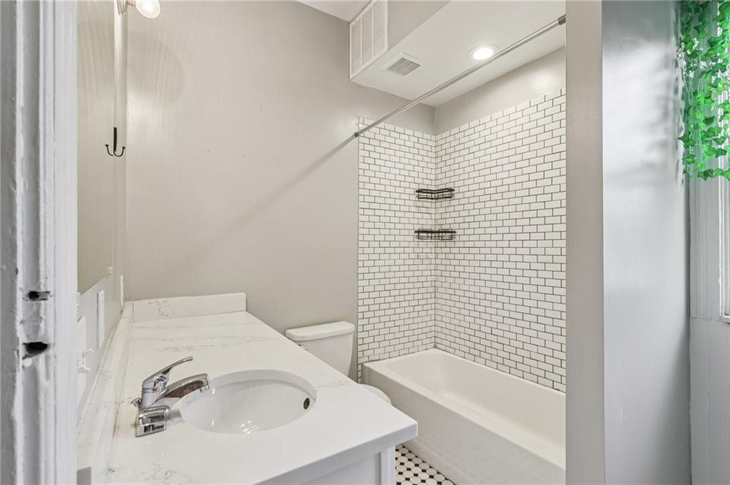 1218 Sherman Avenue Pittsburgh, PA 15212 - Photo 37 of 48 a bathroom with a bathtub and shower