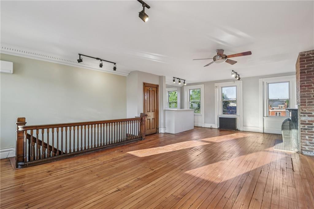 1218 Sherman Avenue Pittsburgh, PA 15212 - Photo 41 of 48 a view of an empty room with window and wooden floor