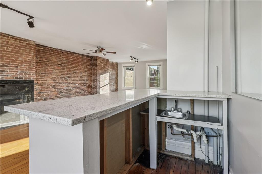 1218 Sherman Avenue Pittsburgh, PA 15212 - Photo 43 of 48 a kitchen with stainless steel appliances granite countertop a sink and cabinets