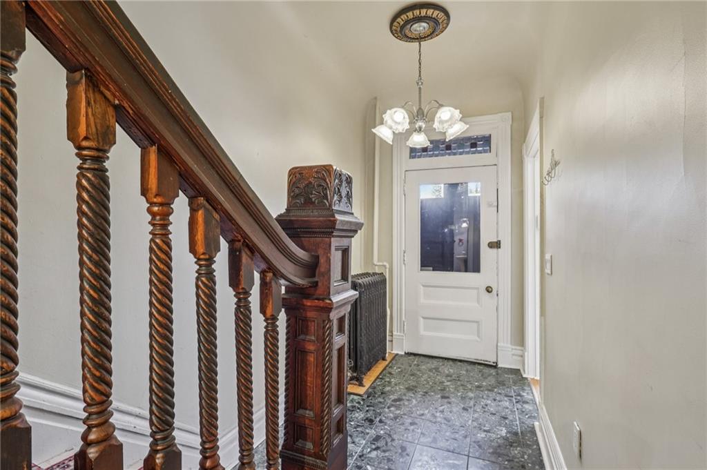 1218 Sherman Avenue Pittsburgh, PA 15212 - Photo 9 of 48 a view of a hallway with wooden floor and staircase