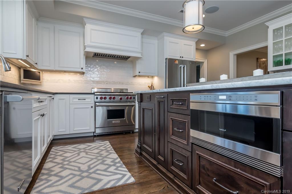 2634 Sharon Road Charlotte, NC 28211 - Photo 12 of 46 a kitchen with a stove and a microwave