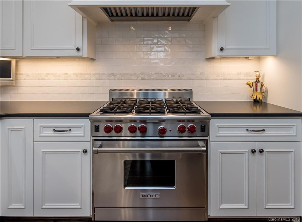 2634 Sharon Road Charlotte, NC 28211 - Photo 13 of 46 a stove top oven sitting inside of a kitchen