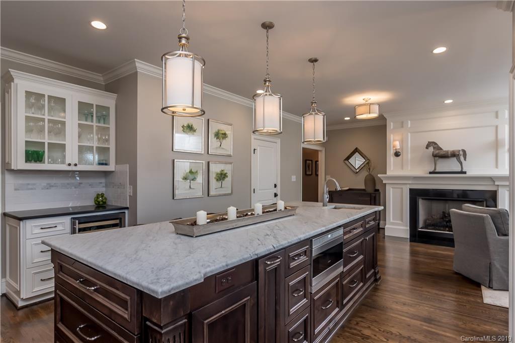 2634 Sharon Road Charlotte, NC 28211 - Photo 14 of 46 a kitchen with a stove and a table