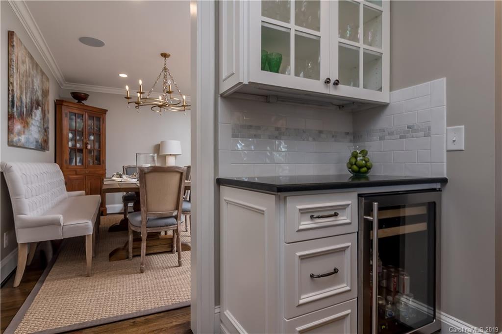 2634 Sharon Road Charlotte, NC 28211 - Photo 15 of 46 a view of a dining room with furniture and chandelier