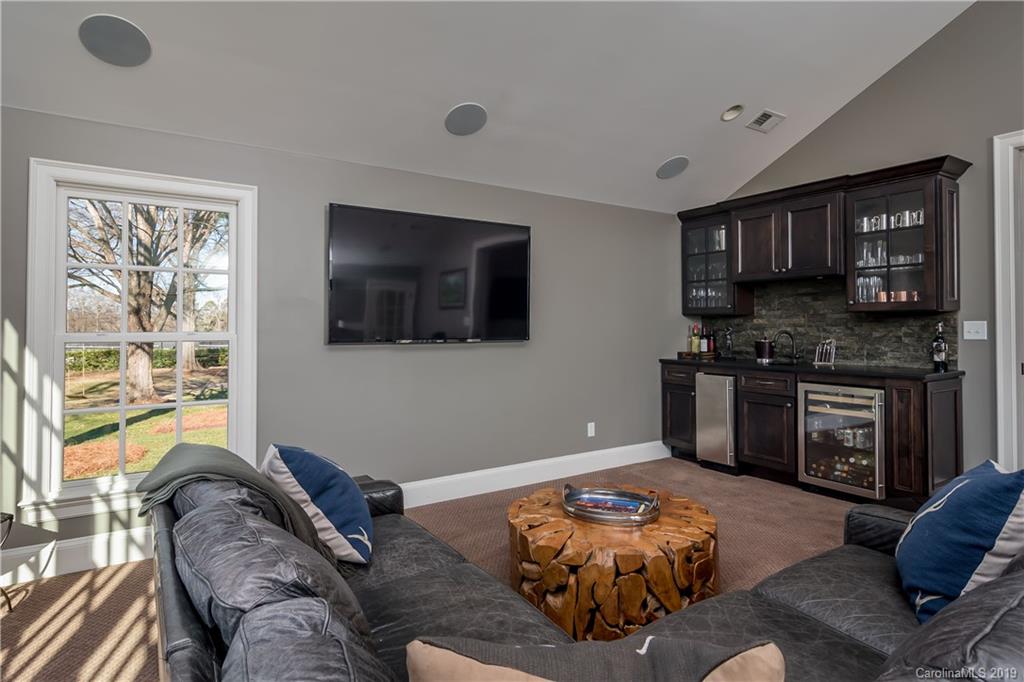 2634 Sharon Road Charlotte, NC 28211 - Photo 18 of 46 a bedroom with furniture and a flat screen tv