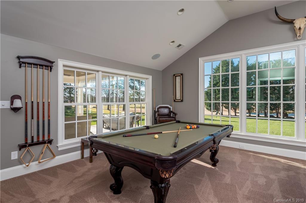 2634 Sharon Road Charlotte, NC 28211 - Photo 19 of 46 a living room with pool table and windows