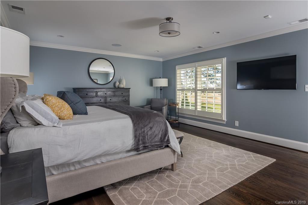 2634 Sharon Road Charlotte, NC 28211 - Photo 20 of 46 a bedroom with a large bed and a flat screen tv