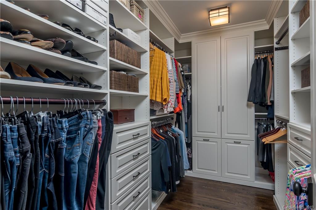 2634 Sharon Road Charlotte, NC 28211 - Photo 26 of 46 a view of walk in closet with clothes and shoes