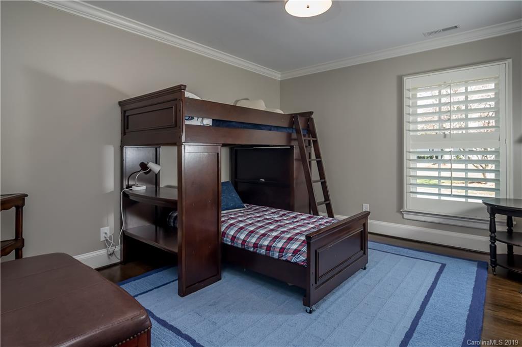 2634 Sharon Road Charlotte, NC 28211 - Photo 27 of 46 a bedroom with a bed and a window