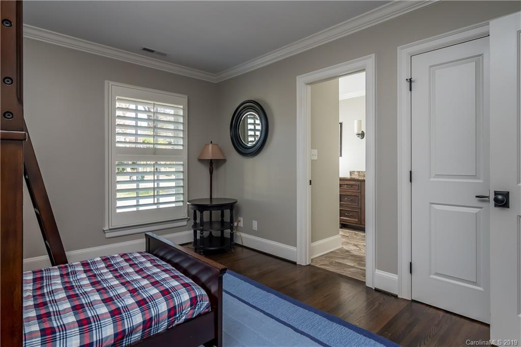 2634 Sharon Road Charlotte, NC 28211 - Photo 28 of 46 a bedroom with a bed and a window