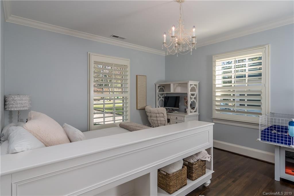2634 Sharon Road Charlotte, NC 28211 - Photo 30 of 46 a bedroom with a bed and a flat screen tv