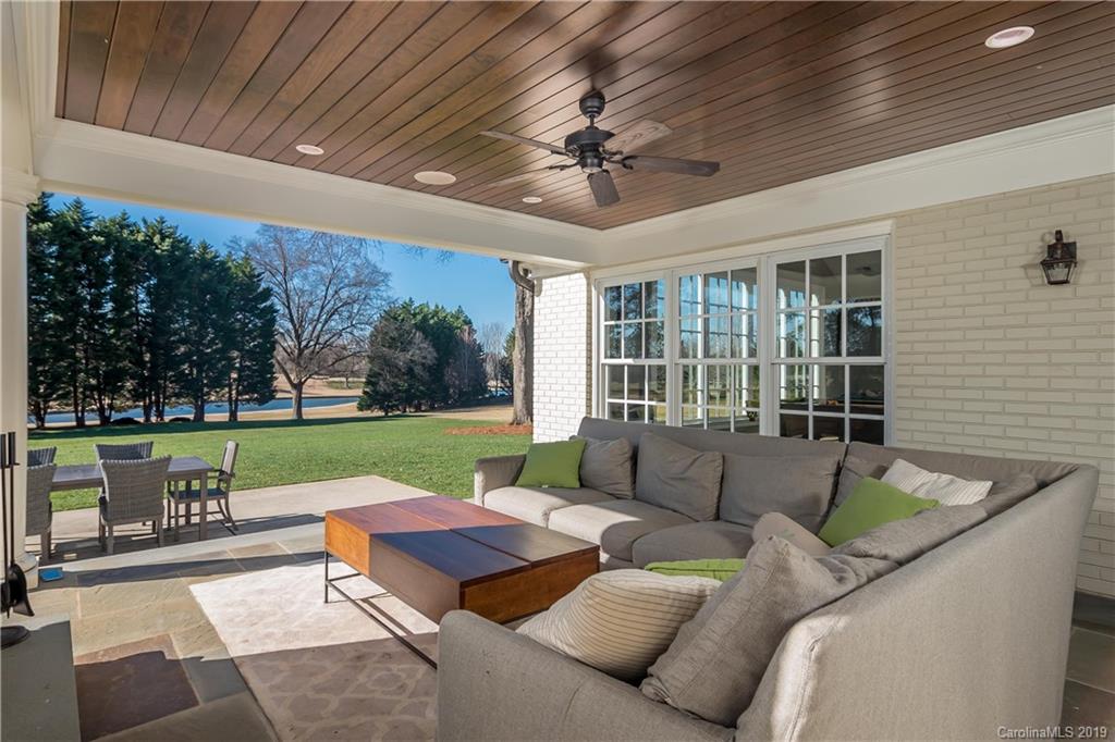 2634 Sharon Road Charlotte, NC 28211 - Photo 39 of 46 a view of a patio with couches chairs and a yard