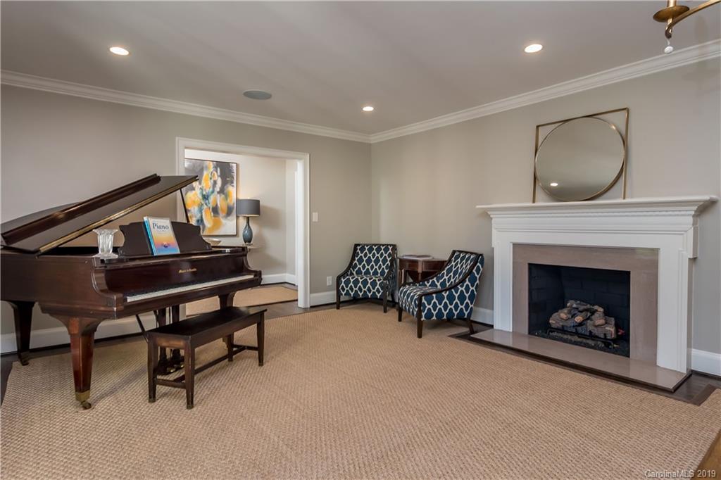 2634 Sharon Road Charlotte, NC 28211 - Photo 6 of 46 a living room with furniture and a fireplace