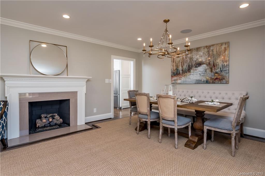 2634 Sharon Road Charlotte, NC 28211 - Photo 7 of 46 a dining room with furniture a chandelier and window