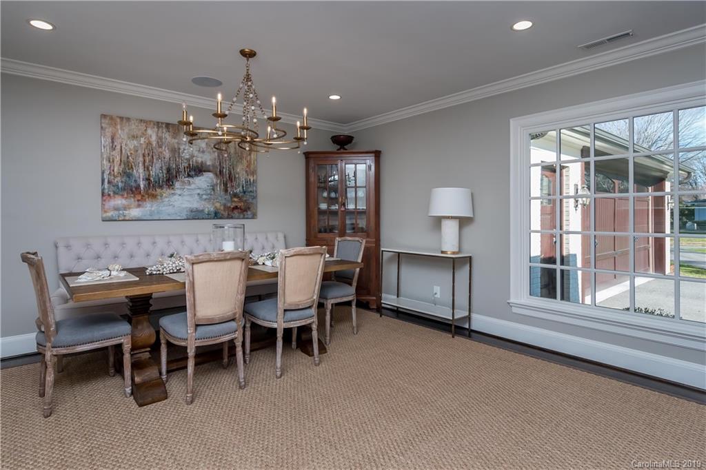 2634 Sharon Road Charlotte, NC 28211 - Photo 8 of 46 a dining room with furniture a chandelier and window