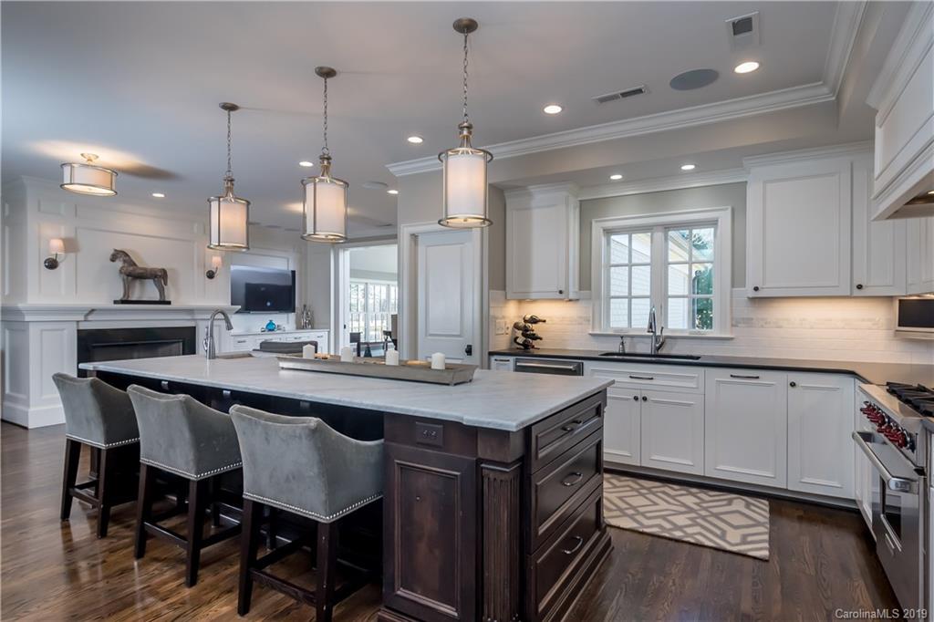 2634 Sharon Road Charlotte, NC 28211 - Photo 9 of 46 a kitchen with counter space sink appliances and cabinets