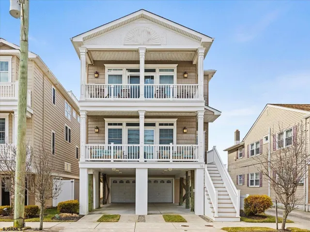 a front view of a building with a lot of windows