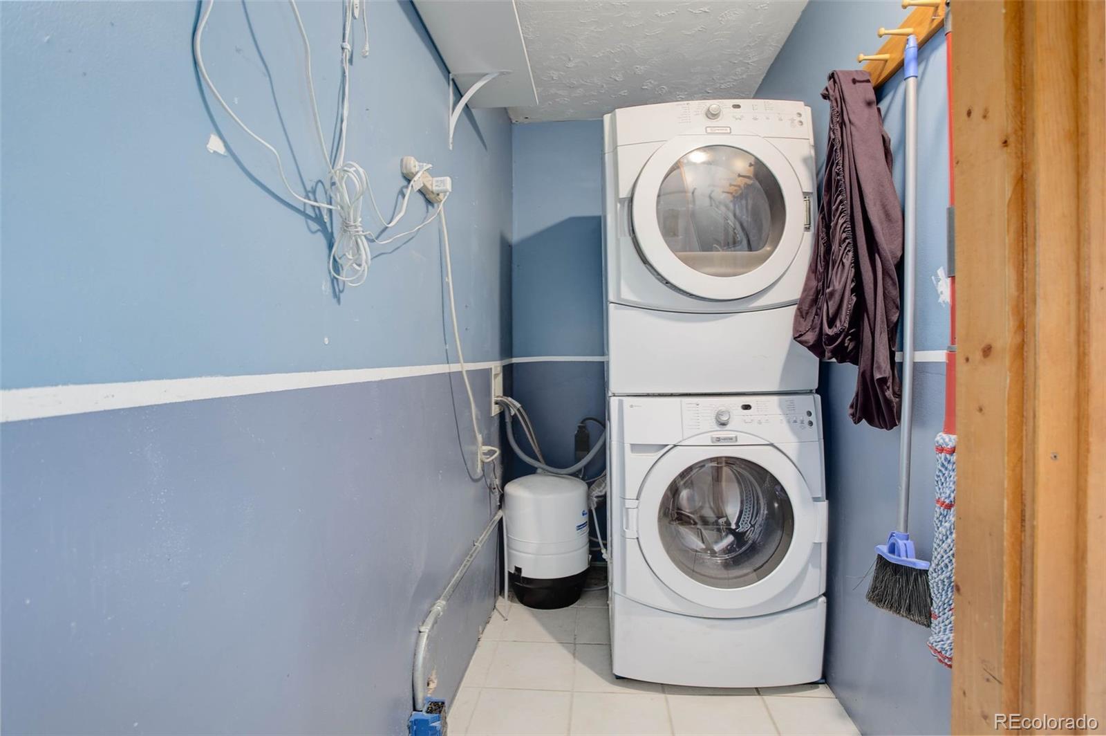 27857 Apex Circle Evergreen, CO 80439 - Photo 13 of 37 a utility room with dryer and washer