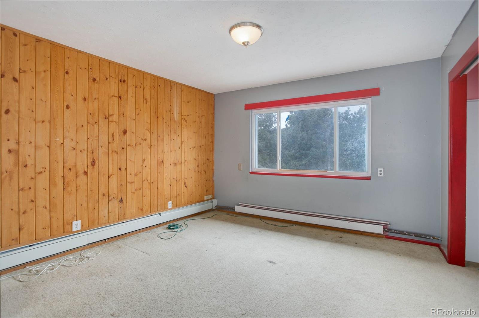 27857 Apex Circle Evergreen, CO 80439 - Photo 18 of 37 a view of an empty room with a window