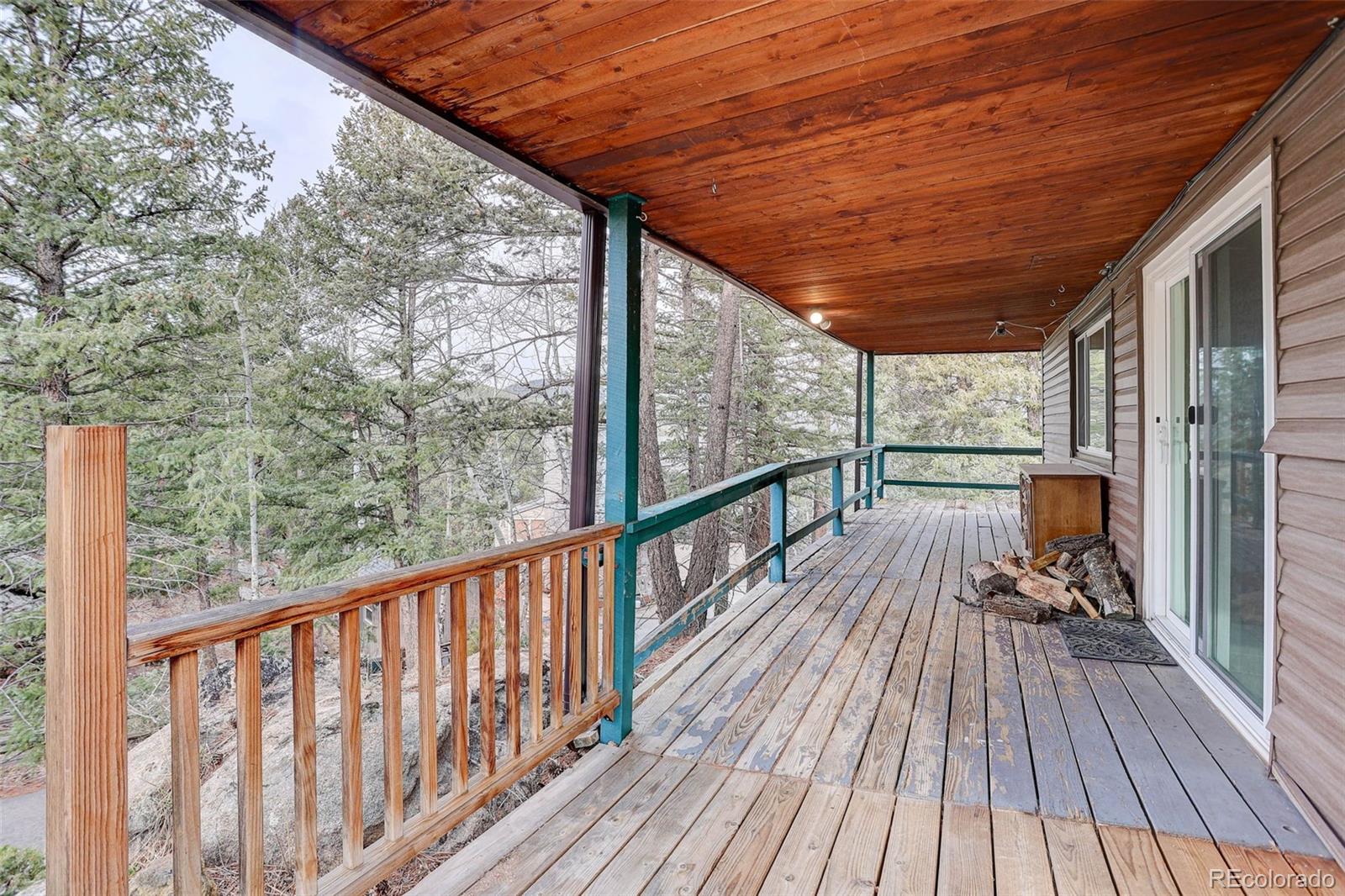 27857 Apex Circle Evergreen, CO 80439 - Photo 20 of 37 a view of balcony with wooden floor