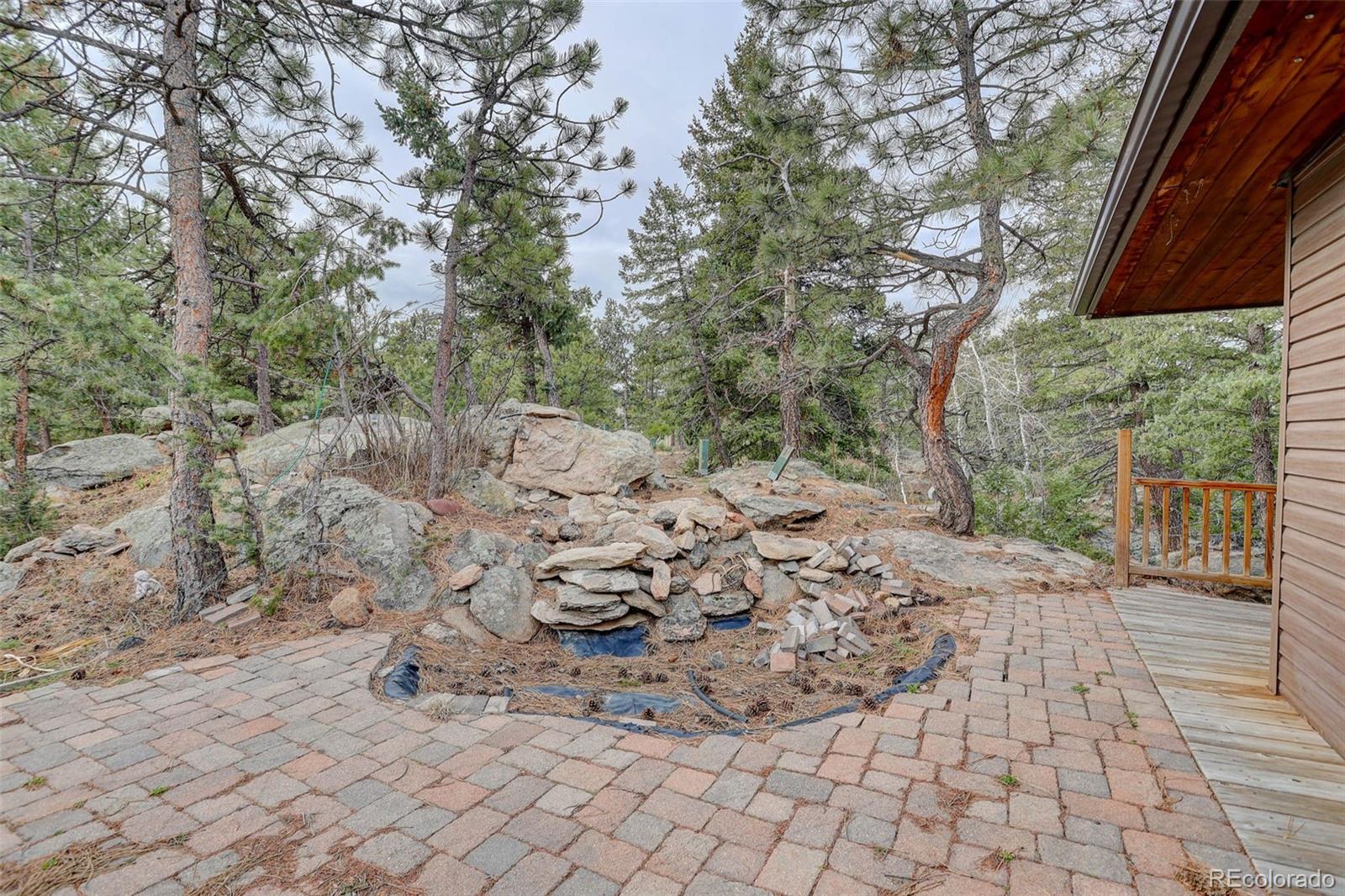 27857 Apex Circle Evergreen, CO 80439 - Photo 2 of 37 a view of a pathway with a yard