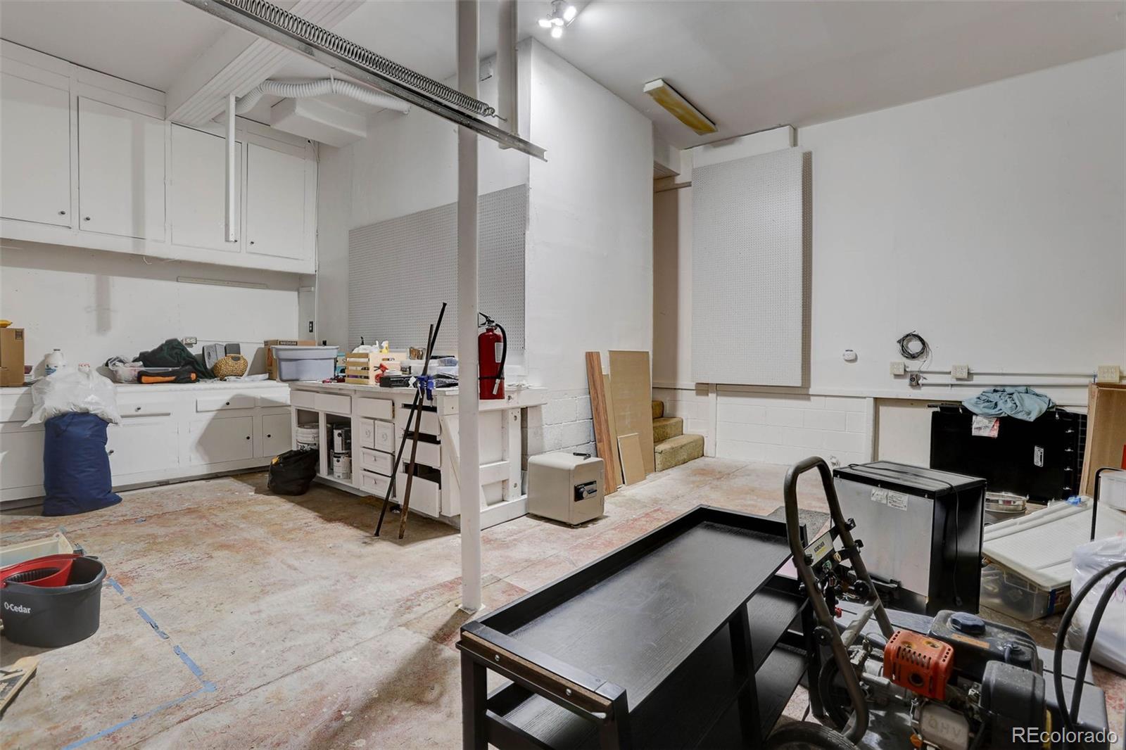 27857 Apex Circle Evergreen, CO 80439 - Photo 26 of 37 a room with a chair and gym equipment